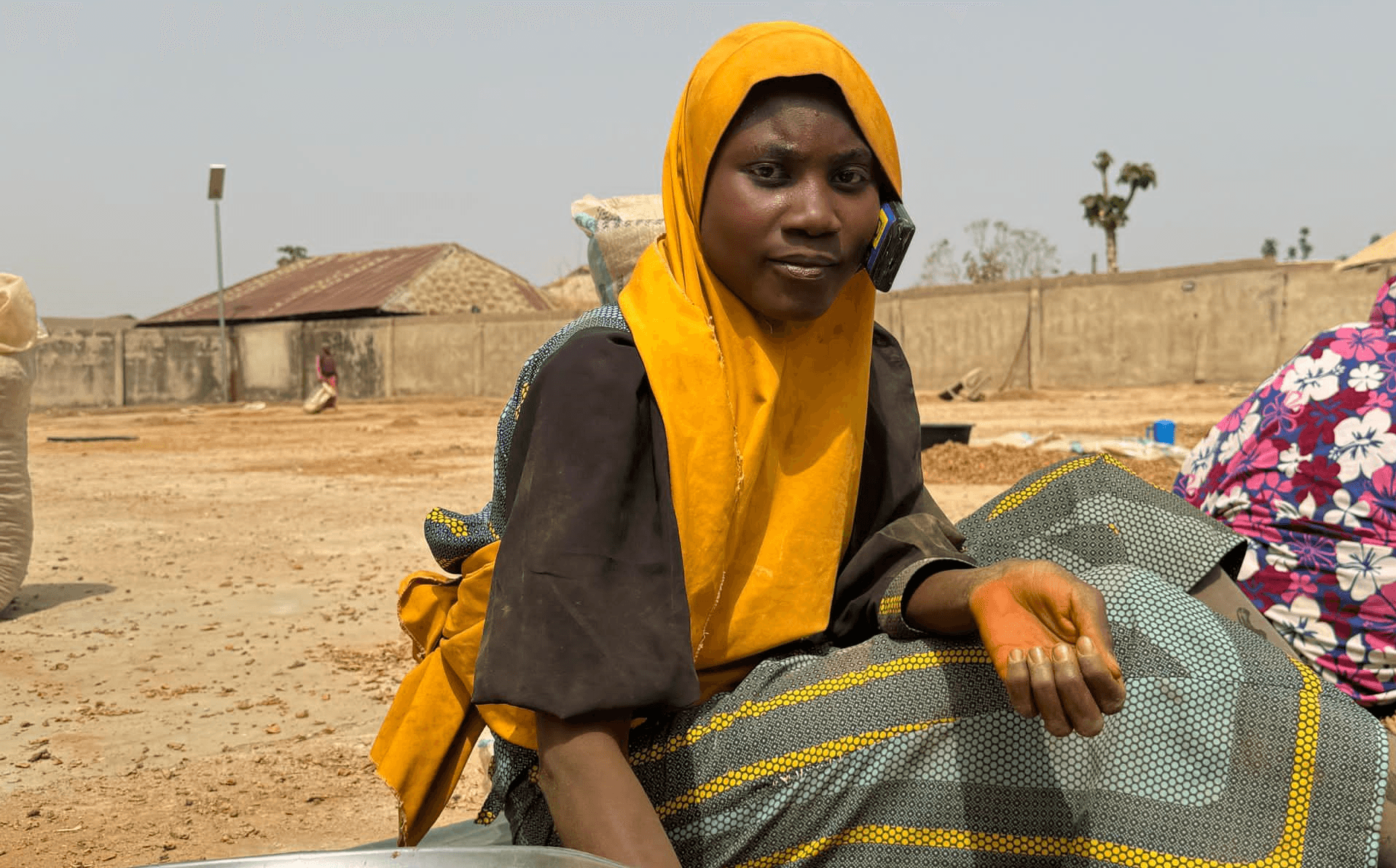 assetium woman farmer cleaning turmeric